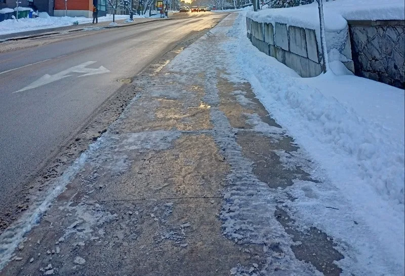 salted sidewalk or road in winter